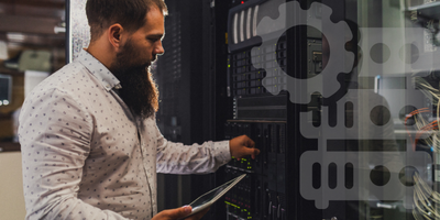 engineer testing server in server room