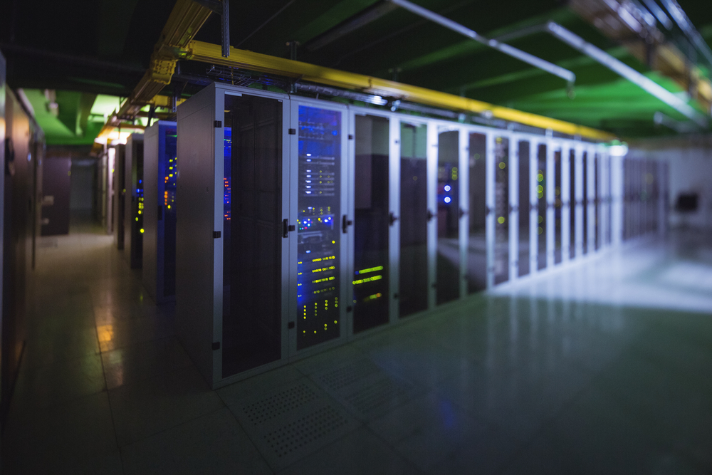 Hallway with a row of servers in server room-2