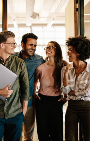 4 team members laughing